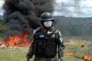 Anti-narcotics and Military Police officers incinerate more than 200 kilos of cocaine seized in southern Honduras near the border with Nicaragua, on the outskirts of Tegucigalpa on August 5, 2016