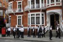 British police officers stand guard outside the Ecuadorian Embassy in central London, Thursday, Aug. 16, 2012 after Ecuadorean Foreign Minister Ricardo Patino announced that he had granted political asylum to WikiLeaks founder Julian Assange. He's won asylum in Ecuador, but Julian Assange is no closer to getting there. The dramatic decision by the Latin American nation to identify the WikiLeaks founder as a political refugee is a symbolic boost for the embattled ex-hacker, but legal experts say that does little to help him avoid extradition to Sweden — and does much to drag Britain and Ecuador into a contentious international faceoff. (AP Photo/Sang Tan)