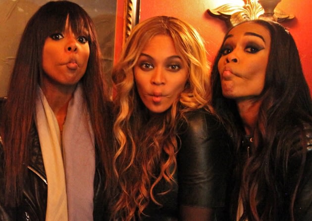 Kelly Rowland, Beyonce and Michelle Williams of Destiny's Child pucker up for the camera -- 