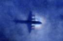File picture shows the shadow of a Royal New Zealand Air Force P-3 Orion maritime search aircraft on low-level cloud, as it flies over the southern Indian Ocean looking for missing Malaysia Airlines Flight MH370