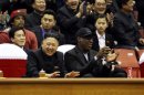 North Korean leader Kim Jong-un and former NBA star Dennis Rodman watch an exhibition basketball game in Pyongyang