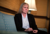 Lynn Waits, 55, of Covington, Ga., sits down to tell her story about complications from having surgical mesh placed in her pelvic cavity, during an interview in her attorney's office, Monday, Jan. 28, 2013, in Athens, Ga. Waits is one of the thousands of women nationwide who have sued manufacturers of the surgical mesh claiming they’ve suffered severe complications and intense physical pain when the flexible plastic mesh hardened inside their bodies. (AP Photo/David Goldman)