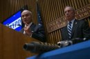 New York City mayor Bloomberg and city police commissioner Kelly are seen with seized guns at the police headquarters in New York