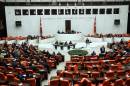Turkish Parliament members convene to vote on a motion seeking a green light for the use of troops in Iraq and Syria in operations against Islamic State group jihadists, in Ankara on October 2, 2014