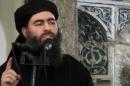This file image made from video posted on a militant website Saturday, July 5, 2014, which has been authenticated based on its contents and other AP reporting, purports to show the leader of the Islamic State group, Abu Bakr al-Baghdadi, delivering a sermon at a mosque in Iraq. Lebanese authorities have detained a wife and son of the leader of the Islamic State group and she is being questioned, two senior Lebanese officials said Tuesday, Dec. 2, 2014. (AP Photo/Militant video, File)