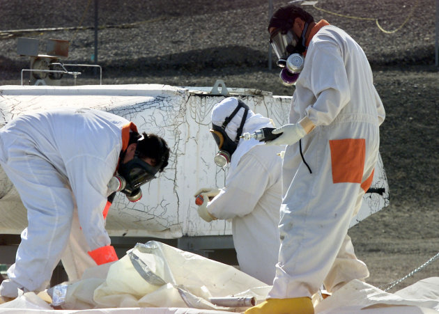 <p> FILE -- In this March 23, 2004 file photo, workers at the tank farms on the Hanford Nuclear Reservation near Richland, Wash., measure for radiation and the presence of toxic vapors. A nuclear safety board has warned a key U.S. senator that underground tanks holding radioactive waste at the nation's most contaminated nuclear site pose a possible risk of explosion. Concerns that hydrogen gas could build up inside the tanks and lead to an explosion at south-central Washington state's Hanford Nuclear Reservation have been known for some time.(AP Photo/Jackie Johnston, File)