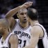 San Antonio Spurs' Tim Duncan, center, congratulates teammates Tony Parker, left, of France, and Manu Ginobili, right, of Argentina, during the third quarter of Game 1 of an NBA basketball Western Conference semifinal playoff series against the Los Angeles Clippers on Tuesday, May 15, 2012, in San Antonio. (AP Photo/Eric Gay)