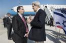 U.S. Secretary of State Kerry speaks with U.S. Ambassador to Israel Shapiro at Ben Gurion International Airport in Tel Aviv