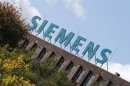The logo of Siemens AG company is pictured atop factory in Berlin