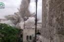 This image made from amateur video posted by Shaam News Network (SNN), an anti-Bashar Assad activist group, which has been verified and is consistent with other AP reporting, shows an explosion that destroyed the Carlton Hotel in Aleppo, Syria, Thursday, May 8, 2014. The rebel-claimed bombing Thursday in the northern Syrian city leveled the once luxurious hotel near the ancient Citadel that government troops used as a military base, causing multiple casualties, activists and militants said.(AP Photo/Shaam News Network via AP video)