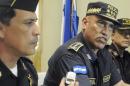 In this July 3, 2012 photo, Honduras Police Chief, Gen. Juan Carlos Bonilla, center, speaks to the press during a news conference in Tegucigalpa, Honduras. The five-star general was accused a decade ago of running deaths squads and today oversees a department suspected of beating, killing and 