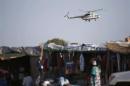 A United Nations helicopter flies over the town of Abyei