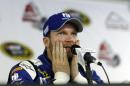 Dale Earnhardt Jr. pauses as he answers a question during an interview at Pocono Raceway in preparation for Sunday's NASCAR Sprint Cup Series auto race in Long Pond, Pa., Friday, June 5, 2015. (AP Photo/Mel Evans)