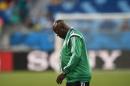 Nigeria's coach Stephen Keshi walks on the pitch ahead of the Group F football match between Nigeria and Bosnia-Hercegovina at The Pantanal Arena in Cuiaba on June 21, 2014