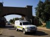 A forensics van leaves the housing estate where Olympian Oscar Pistorius lives, in Pretoria, South Africa, Thursday, Feb. 14, 2013. Reports say that a 30-year-old woman was shot dead at Pistorius's home earlier after being mistaken for an intruder. (AP Photo)