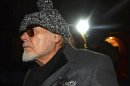 Former British pop star Gary Glitter returns to his home in London