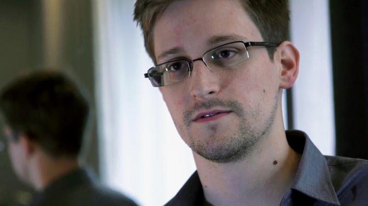 This photo provided by The Guardian Newspaper in London shows Edward Snowden, who worked as a contract employee at the National Security Agency, in Hong Kong, Sunday, June 9, 2013. The man who told the world about the U.S. government’s gigantic data grab also talked a lot about himself. Mostly through his own words, a picture of Edward Snowden is emerging: fresh-faced computer whiz, high school and Army dropout, independent thinker, trustee of official secrets. And leaker on the lam. (AP Photo/The Guardian)   MANDATORY CREDIT