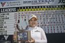 Inbee Park, of South Korea, posses with the champion's trophy after winning the LPGA North Texas Shootout golf tournament, Sunday, May 3, 2015, in Irving, Texas. (AP Photo/LM Otero)