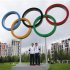 British tennis players Murray and Murray pose for photos with Olympic rings at Olympic Park in London