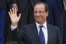 France's President Francois Hollande, waves to the media during a joint statement with Greece's Prime Minister Antonis Samaras at the Elysee Palace, Paris, Saturday, Aug. 25, 2012. (AP Photo/Michel Euler)