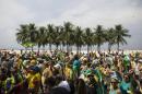 People march to protest the government of Brazil's President Dilma Rousseff along Copacabana beach in Rio de Janeiro, Brazil, Sunday, March 15, 2015. Brazilians are demanding Rousseff's impeachment and blasting what they say is deep government corruption. (AP Photo/Felipe Dana)