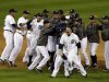 Detroit Tigers' Phil Coke and teammates celebrate after winning Game 4 of the American League championship series against the New York Yankees Thursday, Oct. 18, 2012, in Detroit. The move on to the World Series. (AP Photo/Darron Cummings)