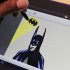 An artist uses the Samsung Galaxy Note to draw a Batman figure at a news conference, Wednesday, Aug. 15, 2012 in New York. Available in the U.S. starting Thursday, the $499 tablet comes with a pen, or more precisely, a stylus. The Galaxy Note shows that the pressure is building on the iPad, and Apple will have to work if it wants to maintain its lead. (AP Photo/Mark Lennihan)
