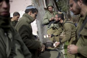 Israeli soldiers of the Golani brigade eat after night&nbsp;&hellip;