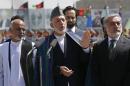 File photo shows Afghan President Karzai, presidential candidates Abdullah and Ghani attending celebrations to commemorate Afghanistan's anniversary of independence in Kabul