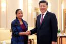 US National Security Adviser Susan Rice shakes hands with Chinese President Xi Jinping during their meeting at the Great Hall of the People in Beijing