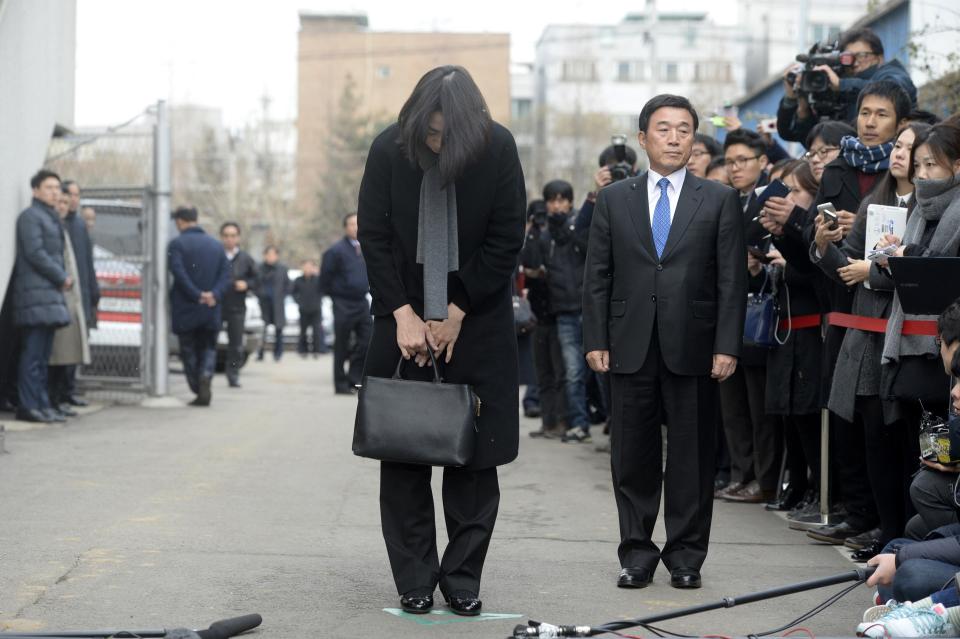 Cho Hyun-ah, daughter of chairman of Korean Air Lines, bows in front of the media outside the offices of the Aviation and Railway Accident...