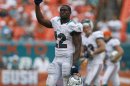 Miami Dolphins' Reggie Bush leaves the field after his team defeated the Oakland Raiders in their NFL football game in Miami Gardens