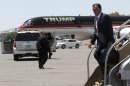 Republican presidential candidate, former Massachusetts Gov. Mitt Romney walks past Donald Trump's airplane as he arrives in Las Vegas, Tuesday, May 29, 2012. (AP Photo/Mary Altaffer)