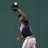 FILE - In this July 21, 2012, file photo, Atlanta Braves center fielder Michael Bourn catches a ball off the bat of Washington Nationals' Roger Bernadina during the first inning of the second baseball game of a doubleheader in Washington. Bourn agreed to a four-year, $48 million contract with the Cleveland Indians on Monday, Feb. 11, 2013. (AP Photo/Carolyn Kaster, File)