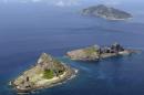 FILE - In this Sept. 2012 photo, the tiny islands in the East China Sea, called Senkaku in Japanese and Diaoyu in Chinese are seen. China said Wednesday, Nov. 27, 2013 it had monitored two unarmed U.S. bombers that flew over the East China Sea in defiance of Beijing's declaration it was exercising greater military control over the area. Tuesday's flight of the B-52 bombers underscored U.S. assertions that it will not comply with Chinese demands that aircraft flying through its newly declared maritime air defense zone identify themselves and accept Chinese instructions. (AP Photo/Kyodo News, File) JAPAN OUT, MANDATORY CREDIT