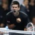 Serbia's Djokovic celebrates beating Switzerland's Federer in their final tennis match at the ATP World Tour Finals in London