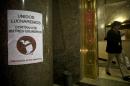 A sign is posted on a wall at the Argentine Economy Ministry reading in Spanish "Together we will fight against the loan shark vultures", referring to an unresolved dispute over $1.5 billion in unpaid debts after its record $100 billion default in 2001, known locally as 