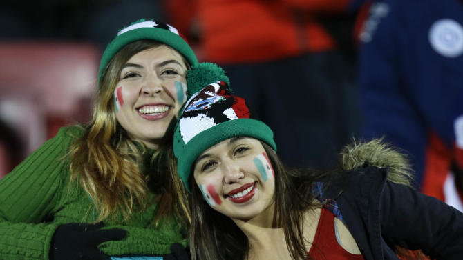 Mexican fans pose before the start of a Copa America Group A soccer match between Chile and Mexico at El Nacional stadium in Santiago, Chile, Monday, June 15, 2015. (AP Photo/Natacha Pisarenko)