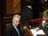 Mario Monti, left, talks at the beginning of a voting session on economic reform measures demanded by the European Union, that should pave the way for Italian Premier Silvio Berlusconi to leave office in a matter of days, at the Senate in Rome, Friday, Nov. 11, 2011. The prospect of a transitional government headed by respected non-partisan economist Mario Monti calmed markets for a second day, with Italy's 10-year borrowing rate down a further 0.21 percentage point to 6.59 percent. Shares were buoyant too, with the Milan stock index was up 1.7 percent in early trading at 15,477. (AP Photo/Pier Paolo Cito)