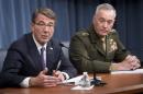 US Secretary of Defense Ashton Carter and Chairman of the Joint Chiefs of Staff Joseph Dunford hold a press briefing at the Pentagon in Washington, DC, March 25, 2016
