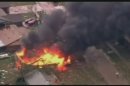 Raw: House Burns After Massive Oklahoma Tornado
