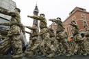 Soldiers from 12 Regiment Royal Artillery mark their return from operations in Iraq and Afghanistan as they process through the streets of Blackpool