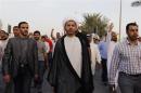General Secretary of Al-Wefaq, Ali Salman, walks as protesters behind him shout anti-government slogans in Budaiya