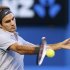 Roger Federer of Switzerland hits a return to Jo-Wilfried Tsonga of France during their men's singles quarter-final match at the Australian Open tennis tournament in Melbourne