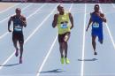 Jamaican sprinter Usain Bolt, center, wins the 200-meter at the Adidas Grand Prix in New York, Saturday, June 13, 2015. Alonso Edward, left, of Panama, and Rasheed Dwyer, right, of Jamaica, also compete. (AP Photo/Bryan R, Smith)