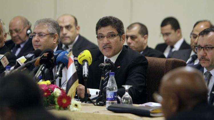 Egyptian Minister of Irrigation, Hossam Maghazi (C), speaks during a Nile River forum with his Sudanese and Ethiopian counterparts in the Sudanese capital Khartoum on August 25, 2014