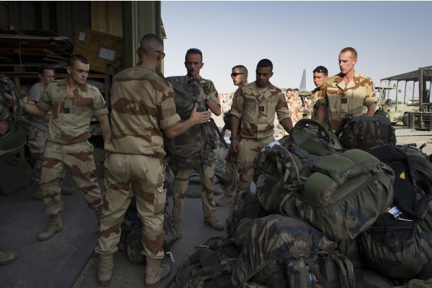 This picture released by the French Army Communications Audiovisual office (ECPAD) shows French soldiers of the 21st Marine Infantry Regiment preparing to board for Bamako, the capital from Mali, at t