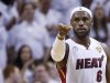 Miami Heat's James reacts after a basket against the San Antonio Spurs during the sceond quarter in Game 7 of their NBA Finals basketball playoff in Miami