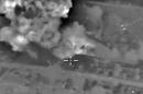 A video grab made on October 14, 2015, purports to show explosions after Russian airstrikes on an Islamic State facility in the vicinity of the city of Aleppo