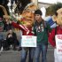 Demonstrators wear masks mocking Italian Premier Silvio Berlusconi, right, and Reform Minister Umberto Bossi carrying placards reading: "Silvio, change my diaper", left, and "I'm looking for confidence, payment in cash" during a demonstration staged by the Italian Democratic party in Rome, Saturday, Nov. 5, 2011. The International Monetary Fund will monitor Italy's financial reform efforts, Premier Silvio Berlusconi said Friday, a humbling step for one of the world's biggest _ but also most indebted _ economies as market confidence in its future wanes. Berlusconi told a press conference Friday at the end of the G-20 summit of world leaders in Cannes that Italy had turned down an offer of financial aid from the IMF. "We don't believe this type of intervention is necessary," he said. (AP Photo/Pier Paolo Cito)